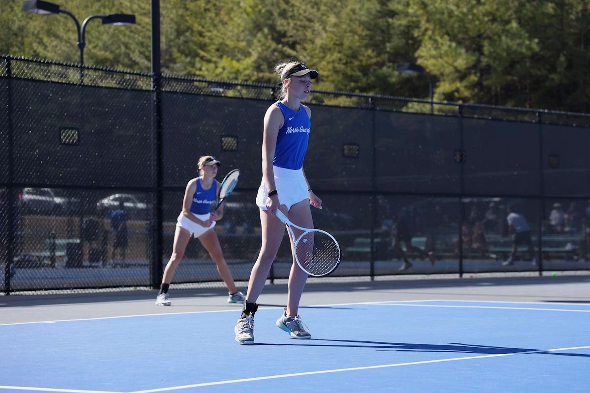 College tennis player Linn Goerdes competing in a doubles match