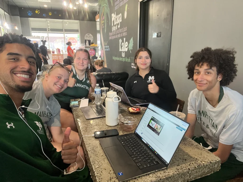 Thea Dahl studying with her teammates