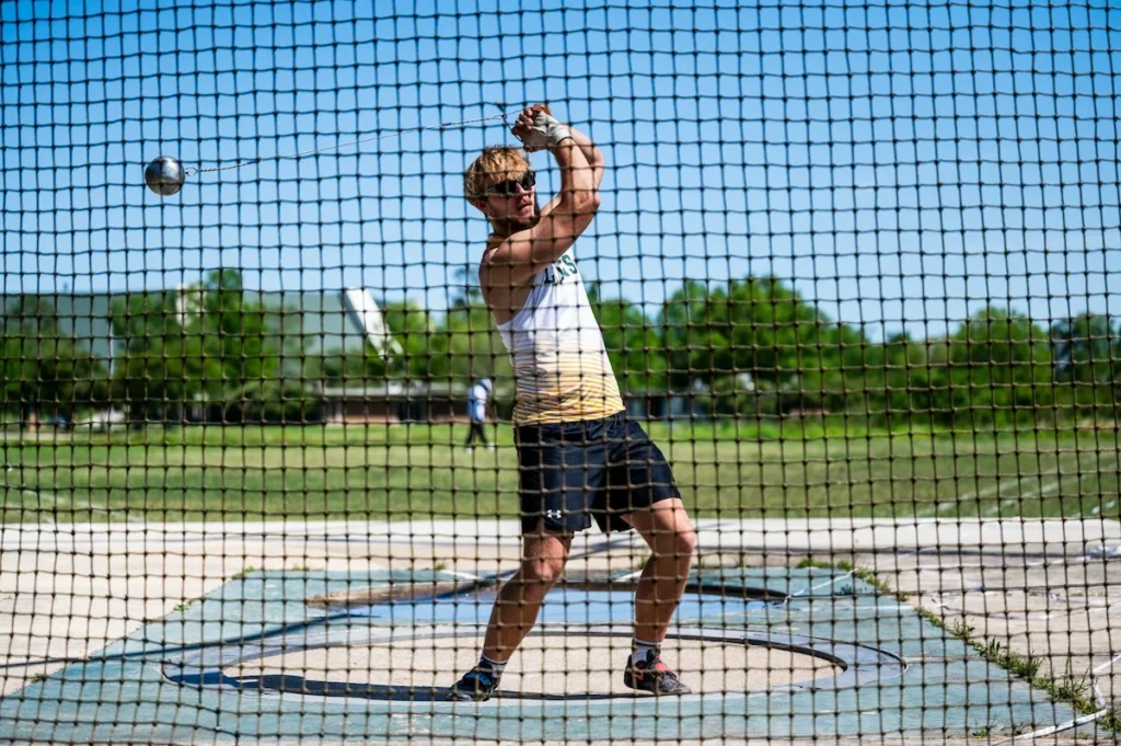 Track and field athlete competing in hammer throw.