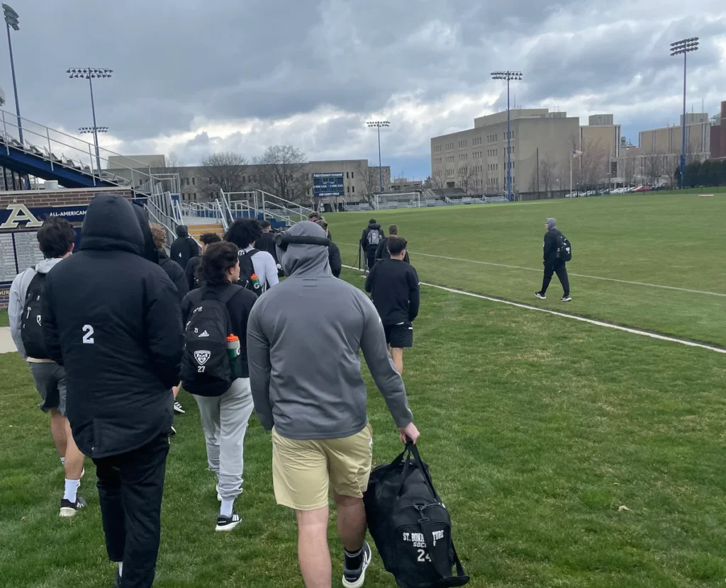 College players arriving to a football game