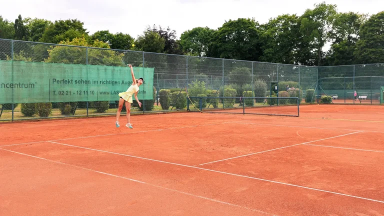 Jumping female tennis player at Keystone Sports College Tennis Showcase
